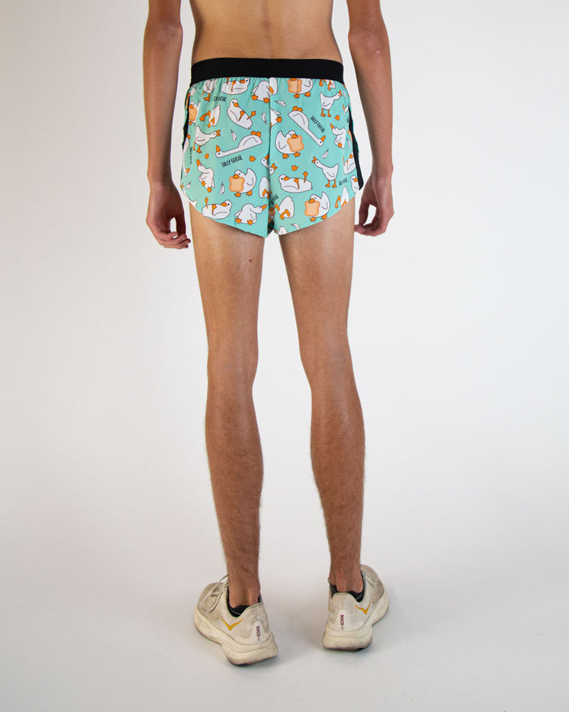 Runner is wearing ChicknLegs in the men's 2 in drawstring split running shorts in the Silly Goose design. The back image is shown.