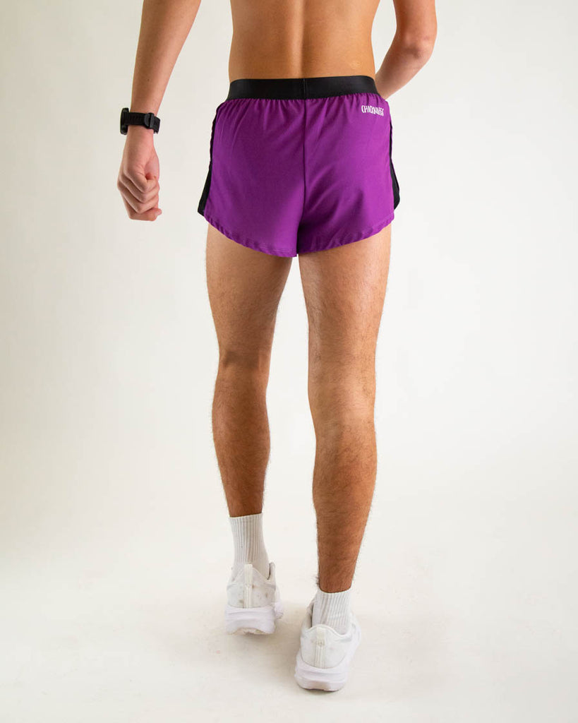 ChicknLegs men's 2 in split running shorts in the solid deep purple color to match with the choccy cow print. The back of the shorts are shown.