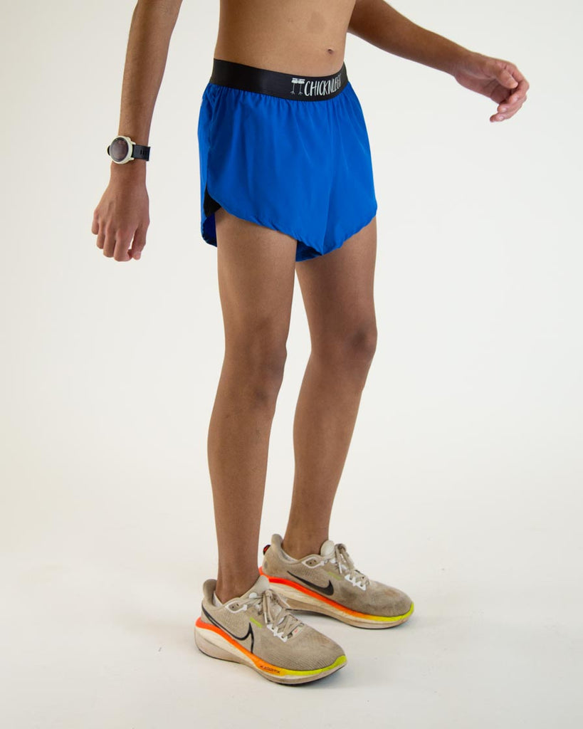 Runner is wearing ChicknLegs in the men's 2 in split running shorts in the solid royal blue design.