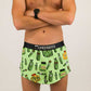 Front closeup view of the men's 2 inch split running shorts with a green pickle design.