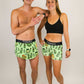 Runners taking a group photo wearing the ChicknLegs pickle running and compression shorts.