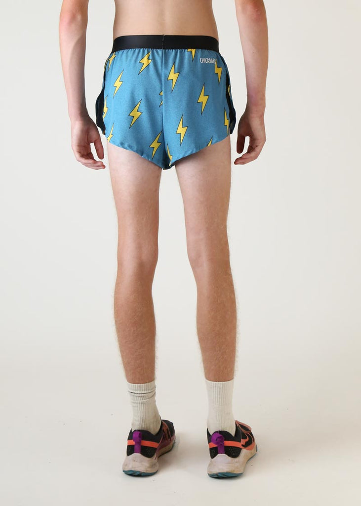 Model wearing chicknlegs mens 2 inch split running shorts with blue bolts design back view