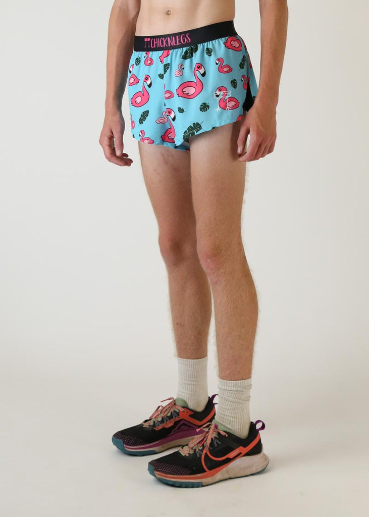 Model wearing Chicknlegs men's 2 inch split running shorts in blue flamingo design left view