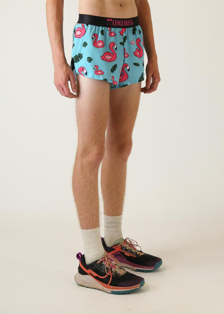 Model wearing Chicknlegs men's 2 inch split running shorts in blue flamingo design right view