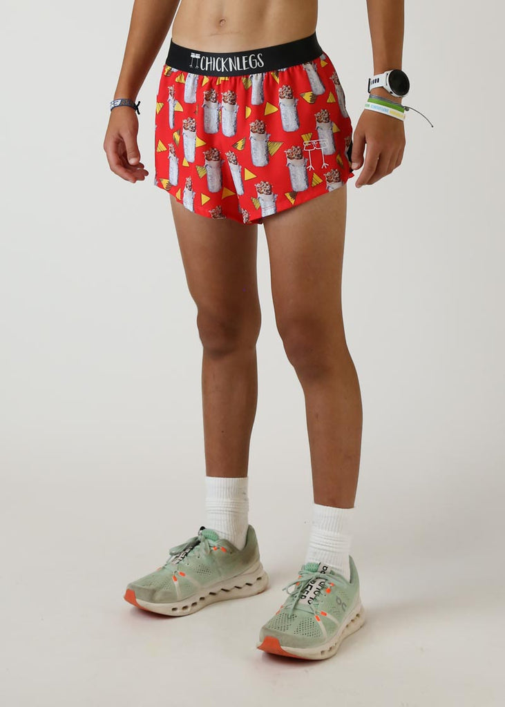 Model wearing Chicknlegs men's 2 inch split running shorts in the burrito design left view