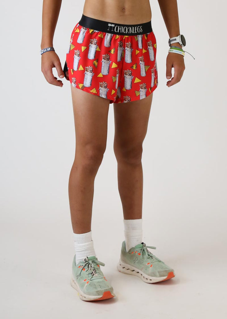 Model wearing Chicknlegs men's 2 inch split running shorts in the burrito design right view