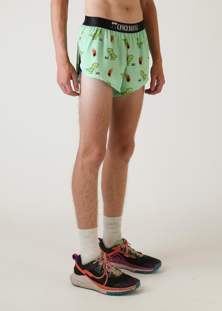 Model wearing chicknlegs mens 2 inch split running shorts with dinos design right view