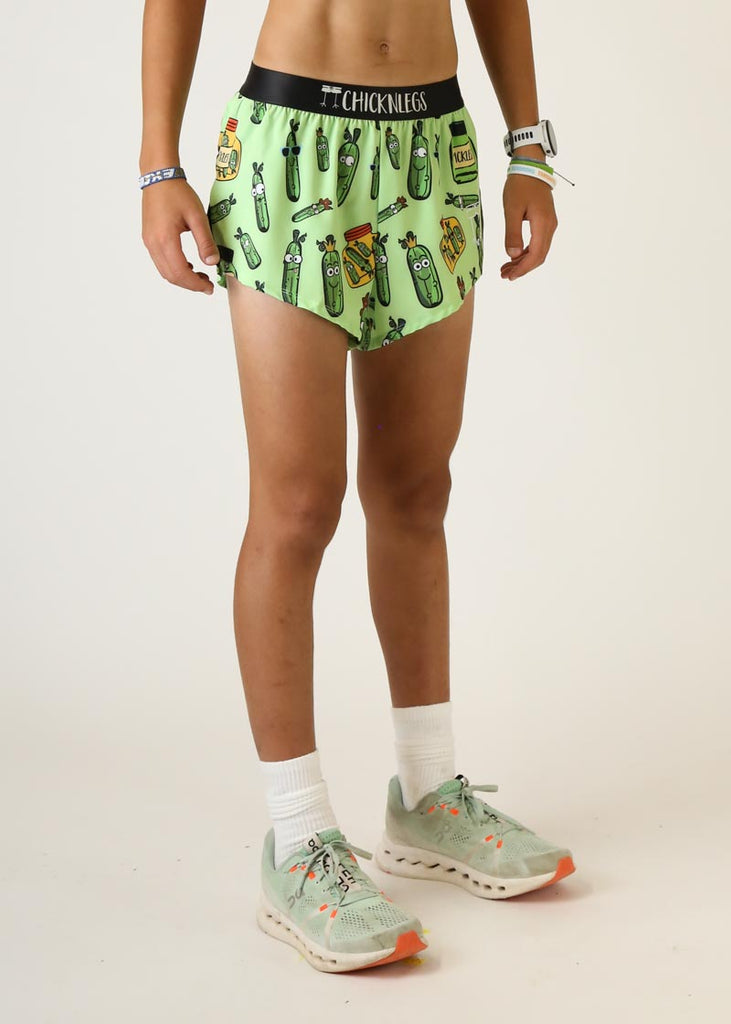 Model wearing Chicknlegs mens 2 inch split running shorts in pickles design right side view