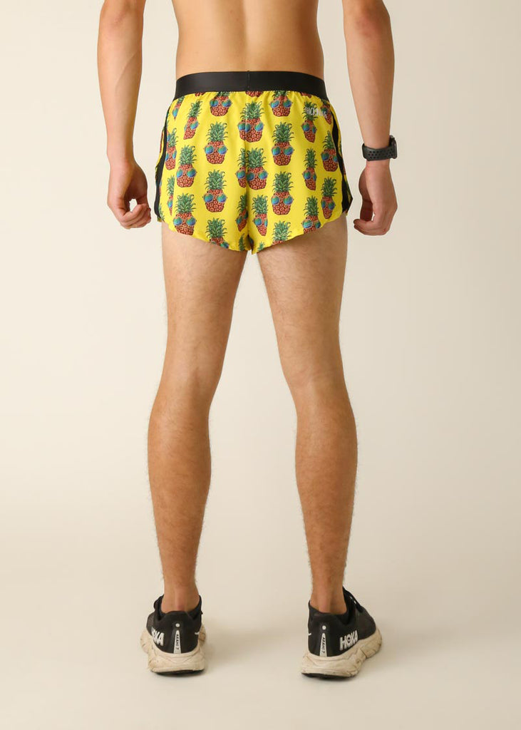 Runner is wearing ChicknLegs in the men's 2 in split running shorts with the pineapple express design. Back of the shorts are shown here in this image, great for pineapple lovers.