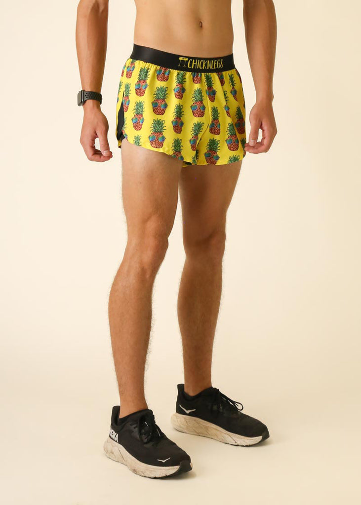 Runner is wearing ChicknLegs in the men's 2 in split running shorts with the pineapple express design. Fun for outdoors and runners who love fruit.