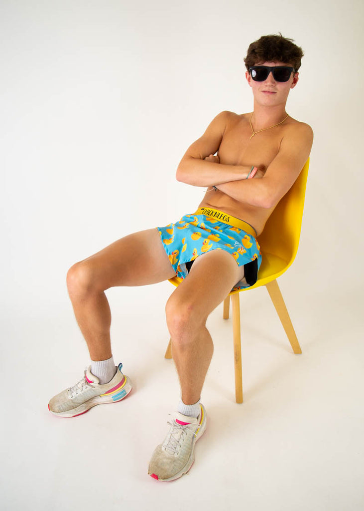 The model is a runner wearing Chicknleg's men's 2 inch split running shorts in the rubber ducky design, facing front.

The model is a runner wearing Chicknleg's men's 2 inch split running shorts in the rubber ducky design, facing left.

The model is a runner wearing Chicknleg's men's 2 inch split running shorts in the rubber ducky design, facing away from the camera to show the shorts.

The model is a runner wearing Chicknleg's men's 2 inch split running shorts in the rubber ducky design, facing front while