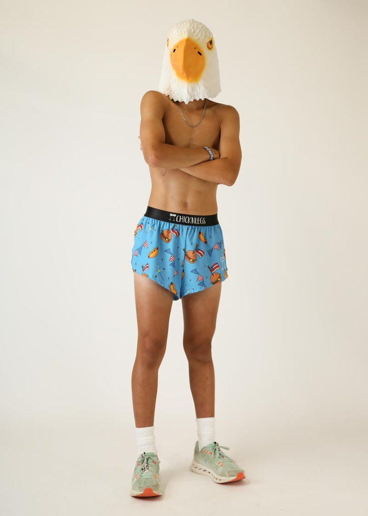 Model wearing Chicknlegs men's 2 inch split running shorts in USA cookout design wearing eagle mask