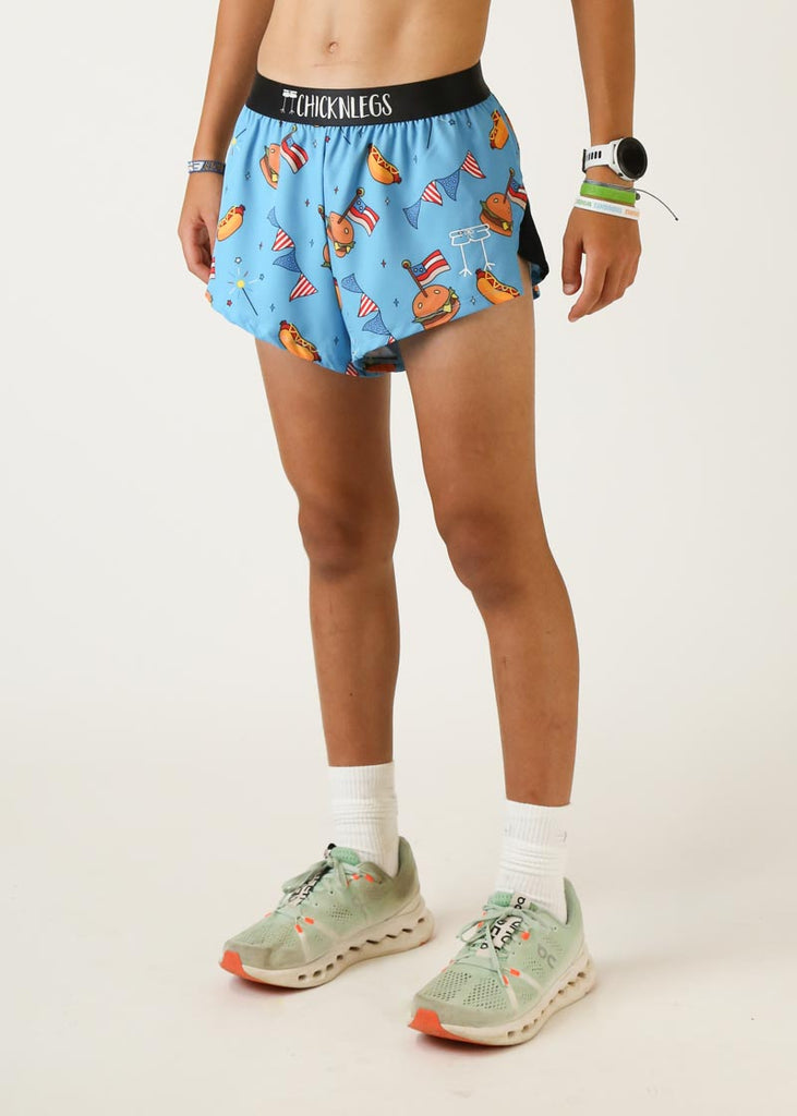 Model wearing Chicknlegs men's 2 inch split running shorts in USA cookout design left view