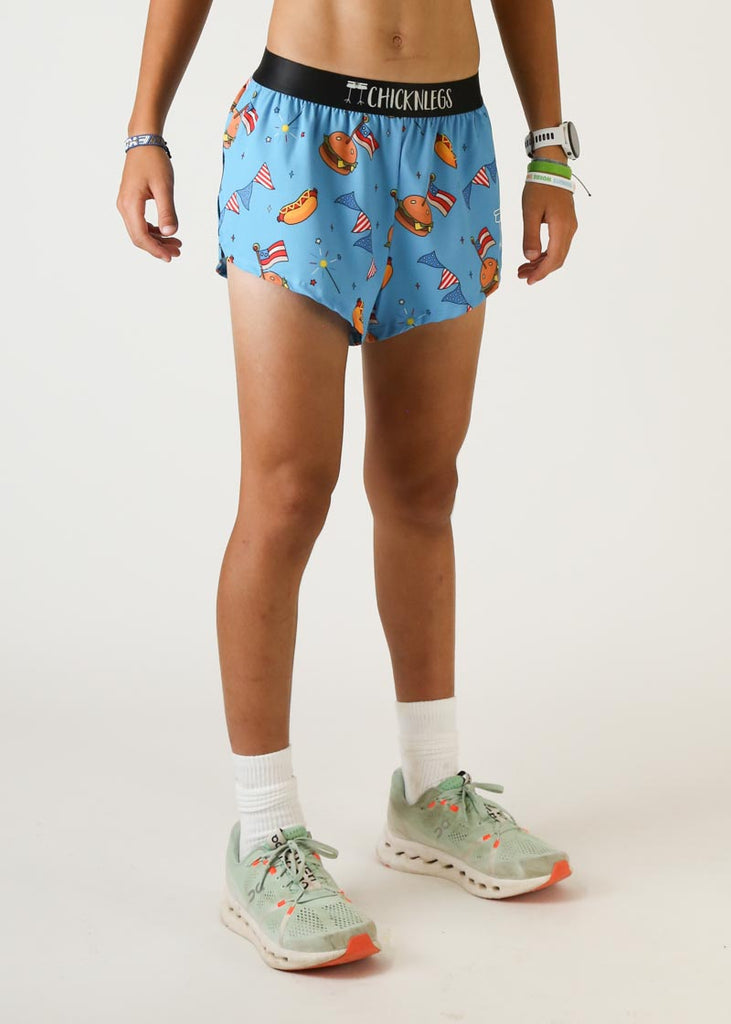 Model wearing Chicknlegs men's 2 inch split running shorts in USA cookout design right side