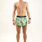 Full body shot of runner wearing the swaggy chickns 2 inch split running shorts from ChicknLegs.