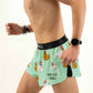 Left side view of the men's 2 inch split running shorts with a chicken design.