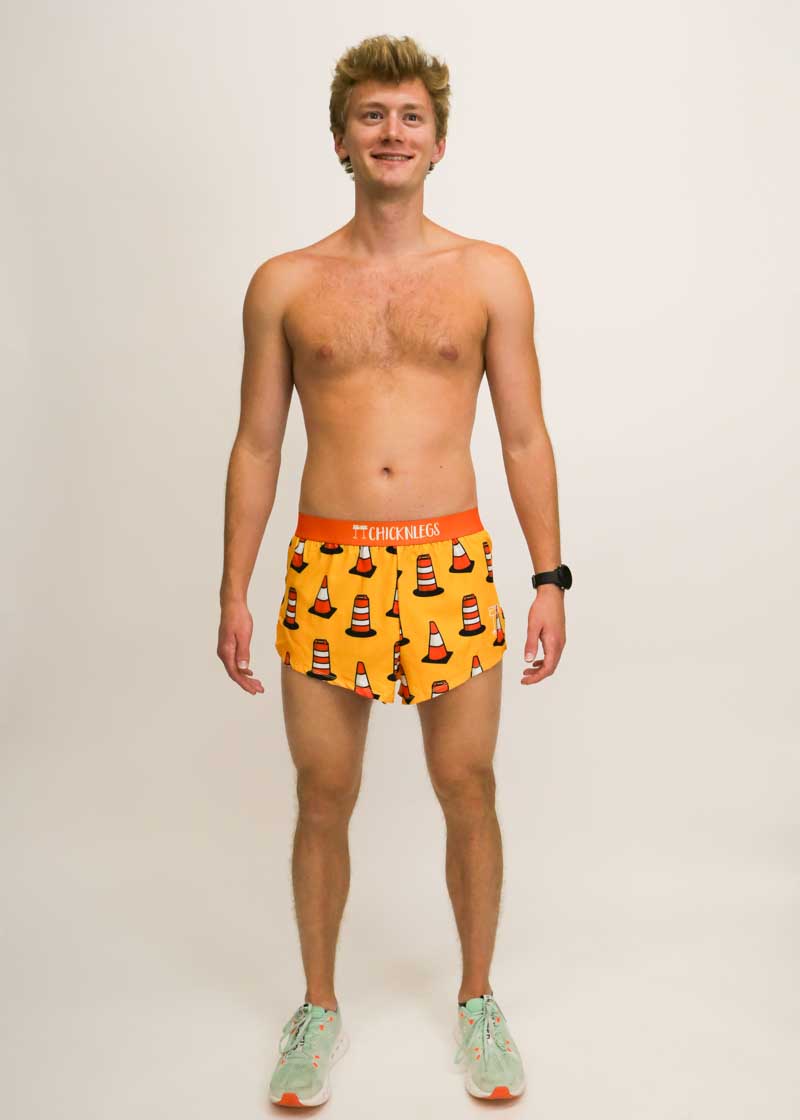 Front view of runner wearing the orange traffic cone running shorts from ChicknLegs.
