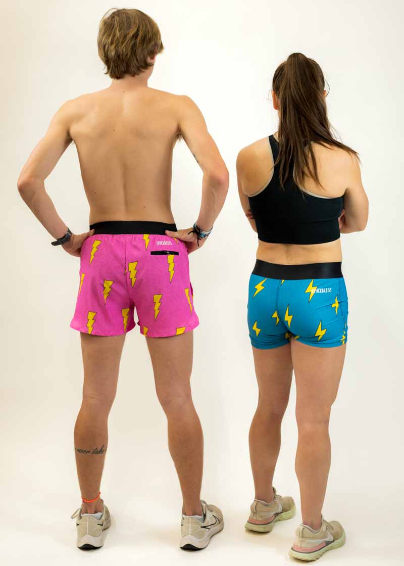 Back view of the men's pink bolts and women's compression blue bolts running shorts.