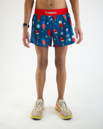 Runner is wearing ChicknLegs in the men's 4 in split running shorts in the USA Popsicle design. The print has red, white, and blue ice cream and stars. The background is blue with a red waistband.