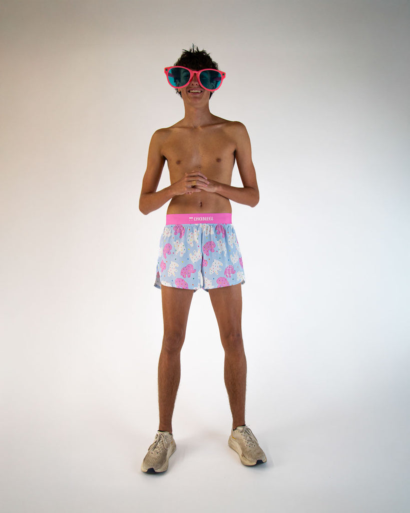 Runner is wearing ChicknLegs in the men's 4 in split running shorts in the Animal Cookies design. Model is posing with giant silly glasses to match the mood of the animal cookies! Many animals are featured, buffalo, gorilla, elephant, bear, bears, and more!