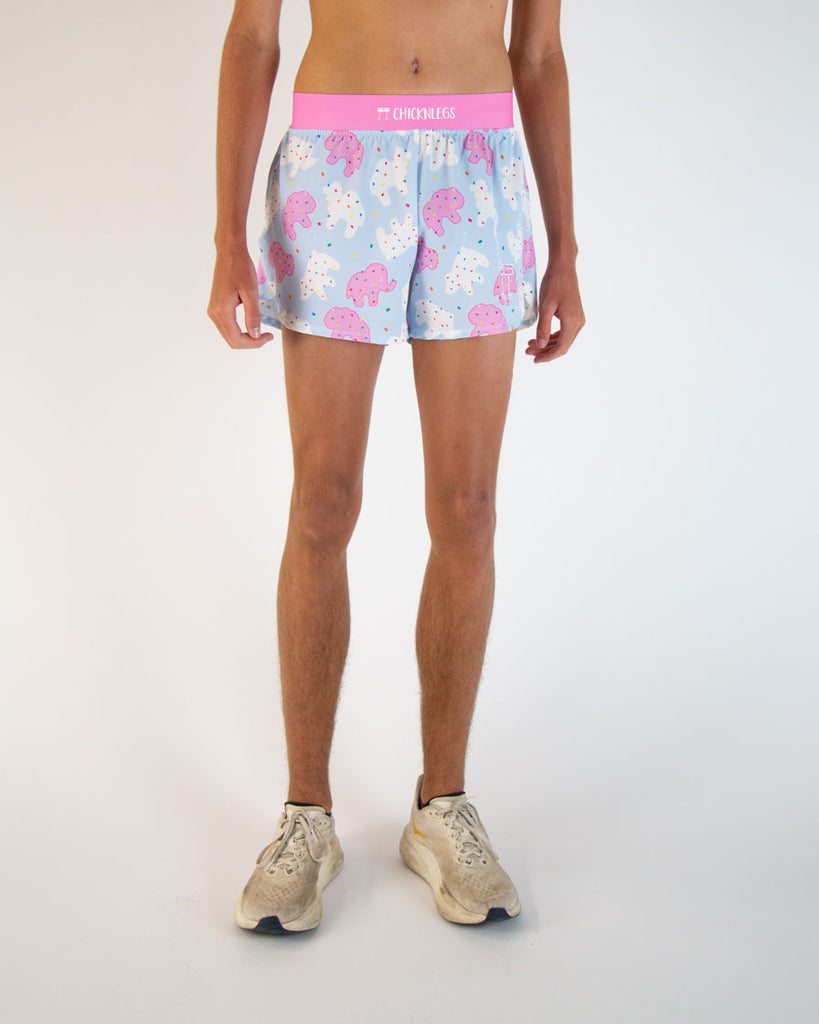 Runner is wearing ChicknLegs in the men's 4 in split running shorts in the Animal Cookies design. This print has white, blue, pink, red, yellow, green, purple, and orange all over it!