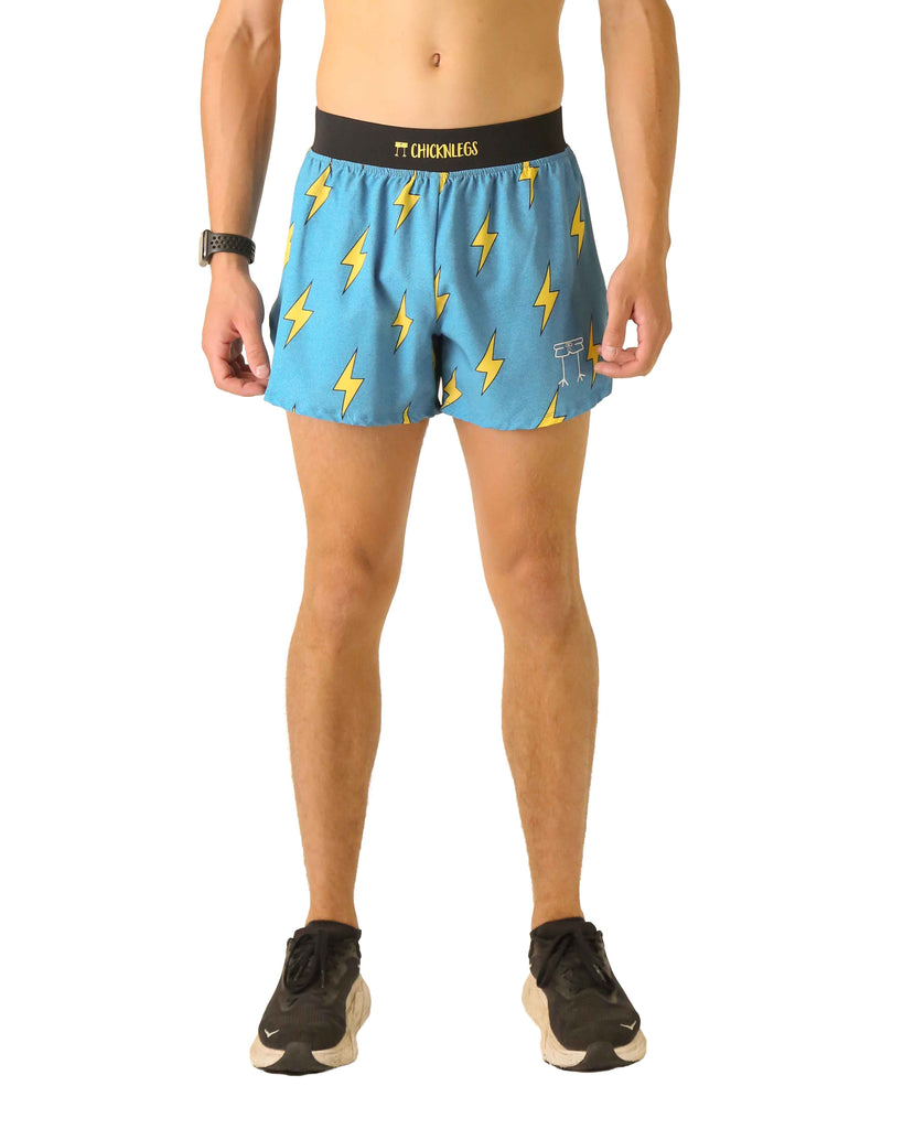 Runner is wearing ChicknLegs in the men's 4 in split running shorts that has a back pocket and inner liner pocket. The print has yellow lightning bolts on a blue background.