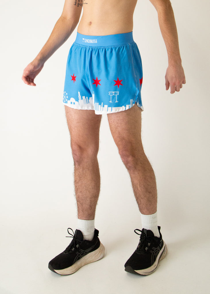 Runner is wearing ChicknLegs in the men's 4 in split running shorts that has the Chicago Style Skylines on it with a white city and blue background with red stars. Great for marathon runners!