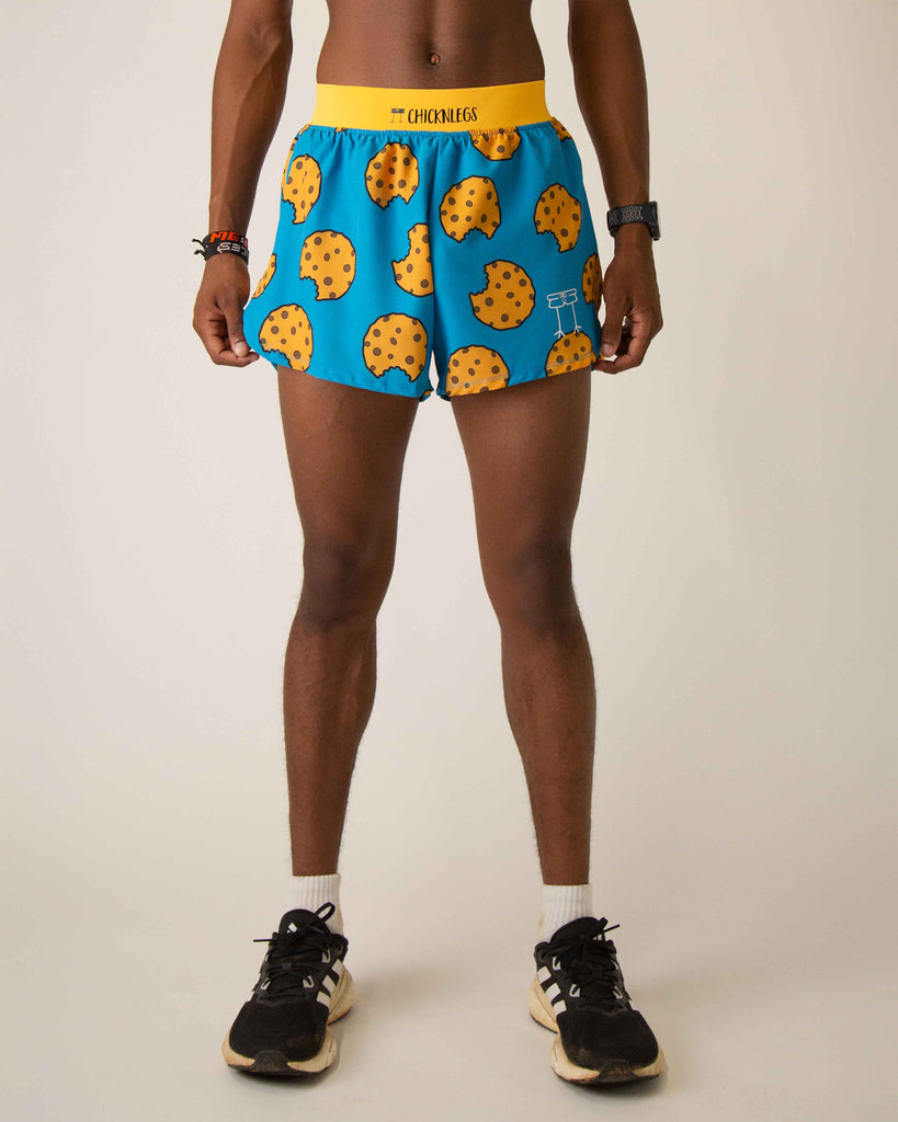 Runner is wearing ChicknLegs in the men's 4 in split running shorts that has a back pocket and inner liner pocket. The print has chocolate chip cookies on it with a blue background.
