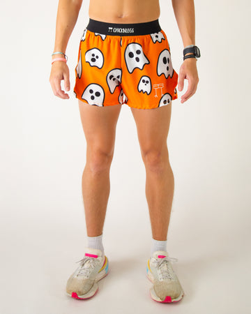 Runner is wearing ChicknLegs in the men's 4 in split running shorts in the ghost design. The print has white ghosts on it with an orange background, great for halloween and any holiday.