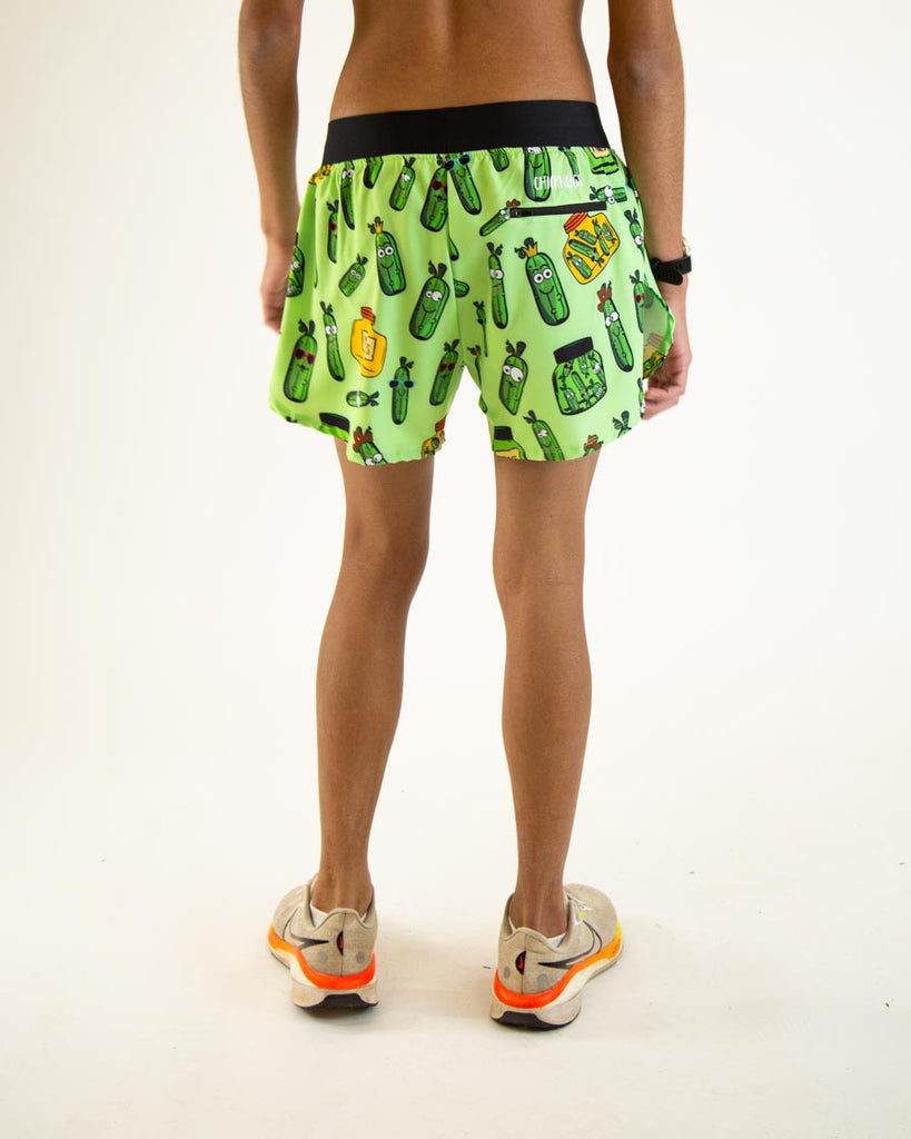 Runner is wearing ChicknLegs in the men's 4 in split running shorts in the pickles design. The image shows the back of the shorts to show the back zipper pocket.