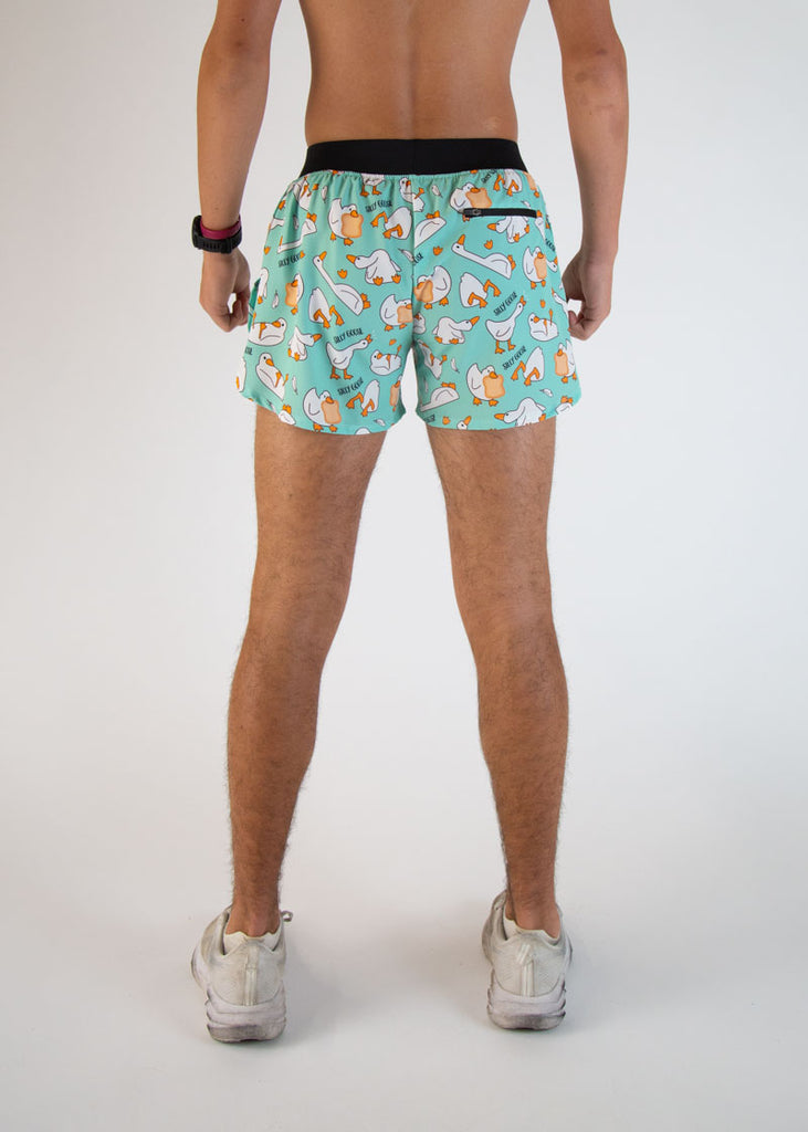 Runner is wearing ChicknLegs in the men's 4 in split running shorts in the Silly Goose Design. The goose is loose! These shorts have a back zipper pocket to help store iphones, andriods, phones, gels, keys, and more!
