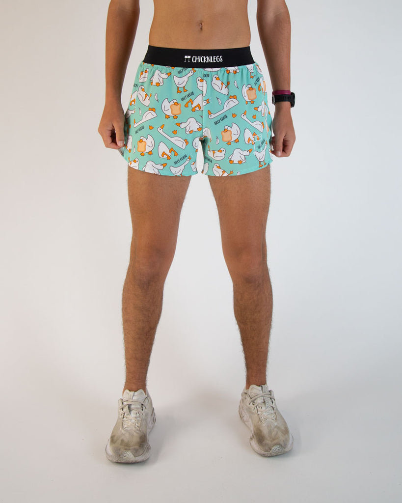Runner is wearing ChicknLegs in the nen's 4 in split running shorts in the Silly Goose Design. The print has white goose on it with a ton of bread all over it.