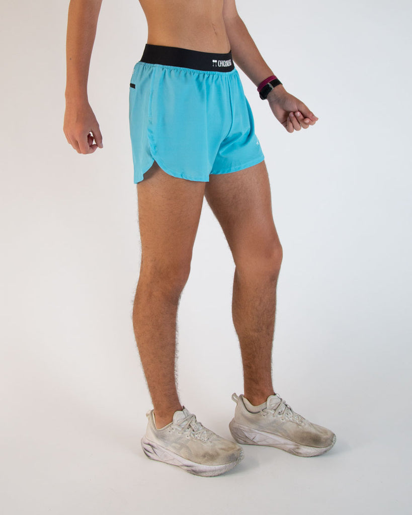 Runner is wearing ChicknLegs in the men's 4 in split running shorts in the sky blue design. Great for matching fits with the blue flamingo performance singlet.