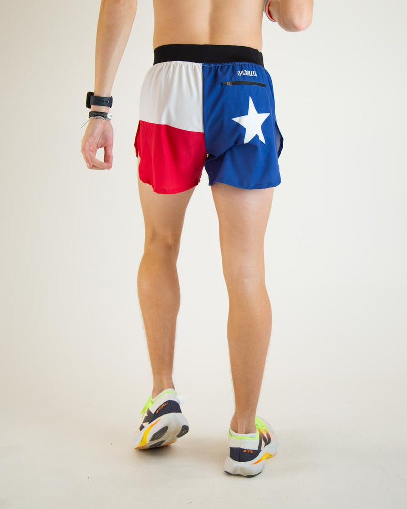 Runner is wearing ChicknLegs in the men's 4 in split running shorts in the Texas Flag design with a back zipper pocket.