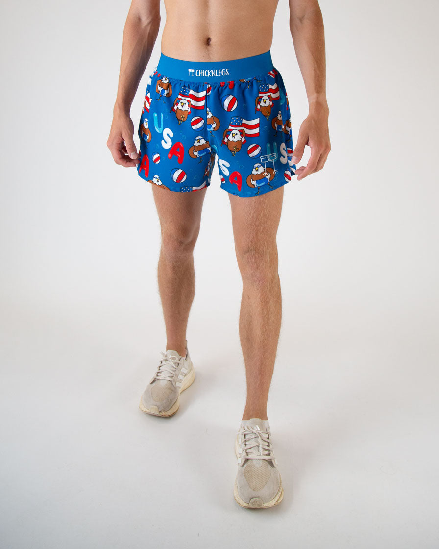 Runner is wearing ChicknLegs in the men's 4 in split running shorts in the USA Pool Party Design. The print has bald eagles on it, red white and blue, pool floaties and the american flag all over it. 