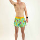 Runner stretching while wearing the men's 4 inch green llamas running shorts from ChicknLegs.