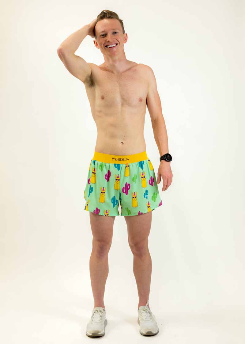 Runner stretching while wearing the men's 4 inch green llamas running shorts from ChicknLegs.