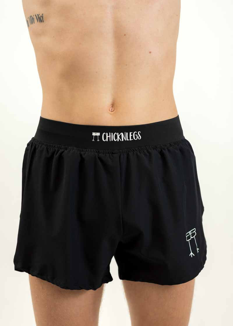 Close up front shot of the men's black 4 inch half split running shorts from ChicknLegs.