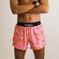 Front view of the men's pink bananas 4 inch split running shorts from ChicknLegs.