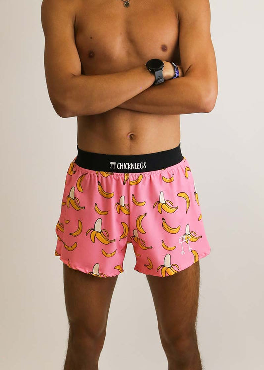 Front view of the men's pink bananas 4 inch split running shorts from ChicknLegs.