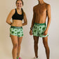 Runners smiling while wearing the sea turtle running shorts from ChicknLegs.