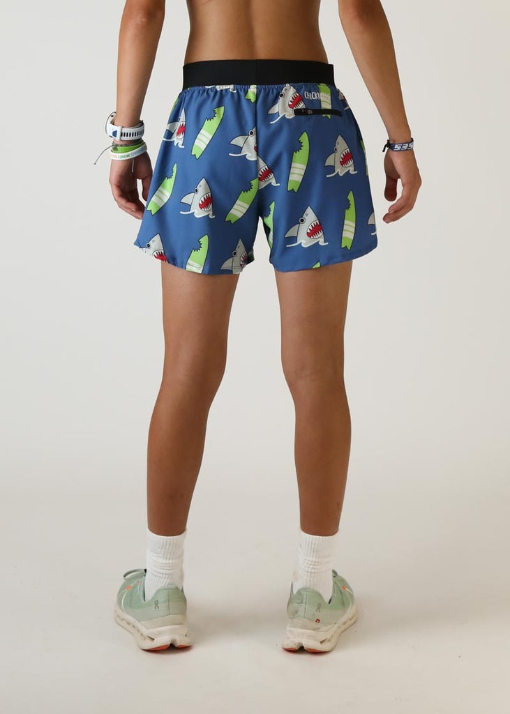 Model wearing Chicknlegs men's 4 inch split running shorts blue shark design back view