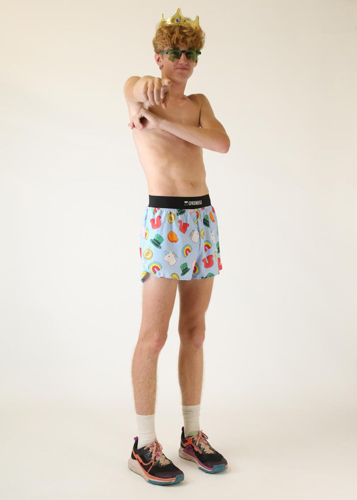 Model wearing Chicknlegs men's 4 inch split running shorts charms design posing with crown