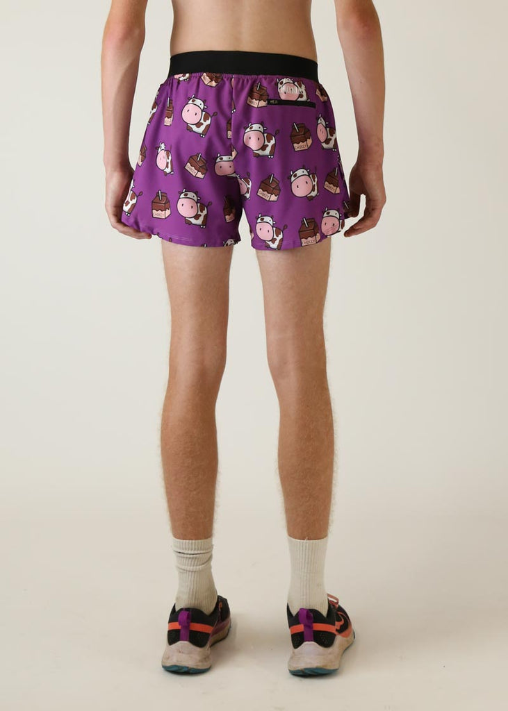 Model wearing Chicknlegs men's 4 inch split running shorts choccy cow design back view