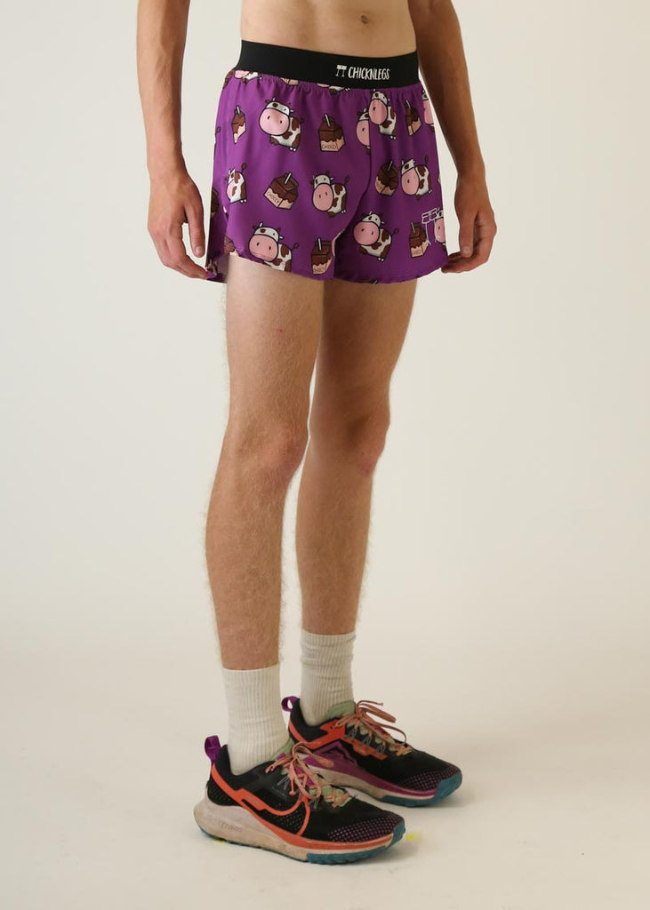 Model wearing Chicknlegs men's 4 inch split running shorts choccy cow design right view
