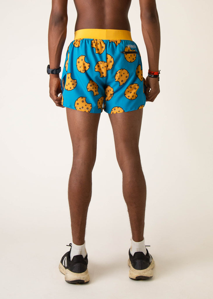 Model wearing Chicknlegs in mens 4 inch split running shorts in the cookies design, facing away from the camera to show the back view.
