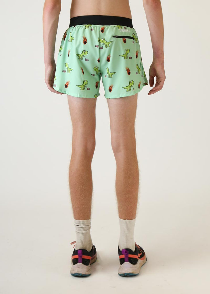 Model wearing Chicknlegs men's 4 inch split running shorts in dinos design back view