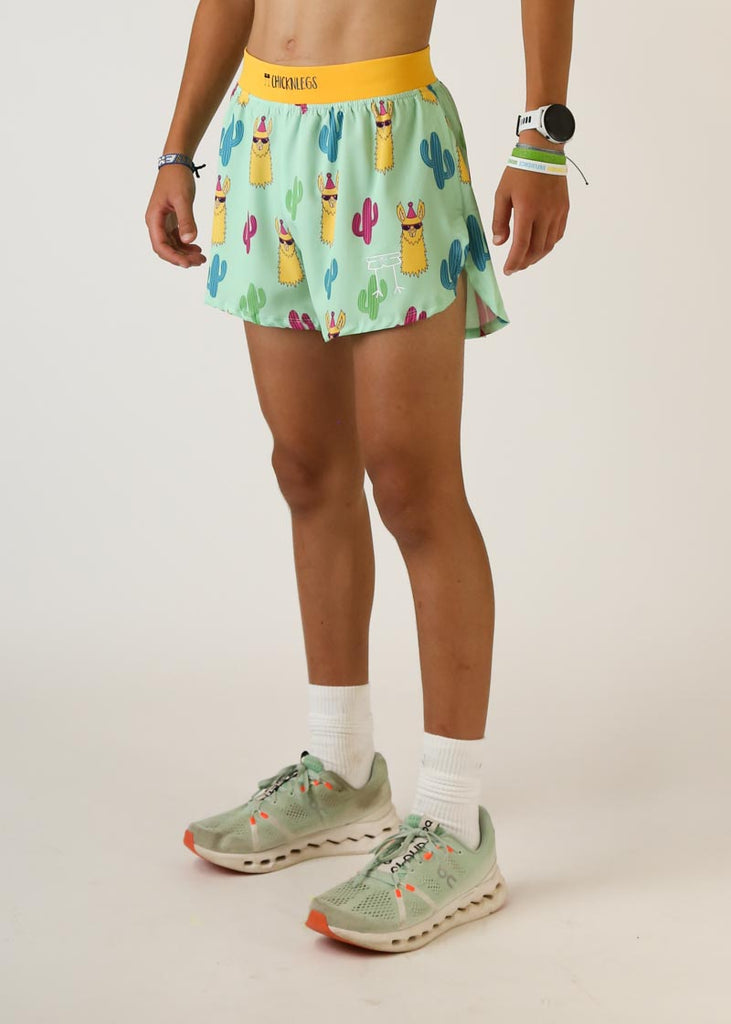 Model wearing Chicknlegs men's 4 inch split running shorts green llama design left view