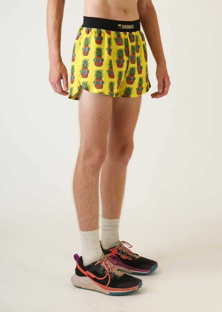 Model wearing Chicknlegs men's 4 inch split running shorts pineapple express design right view