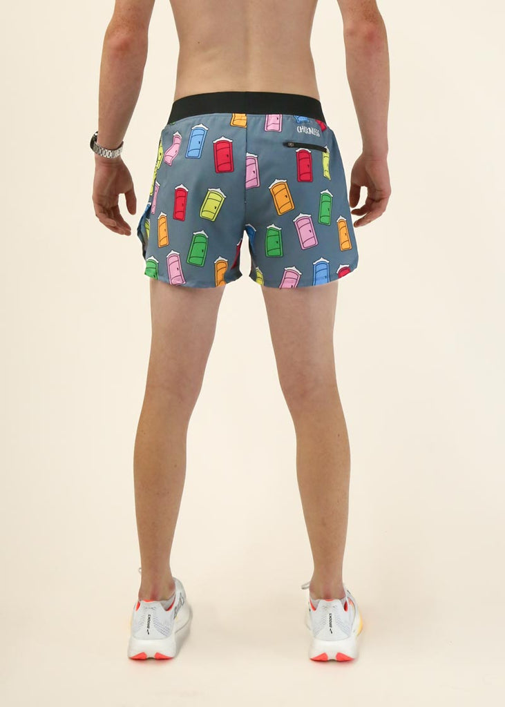 Model wearing Chicknlegs men's 4 inch split running shorts in the porta potty design facing back for back view shot.